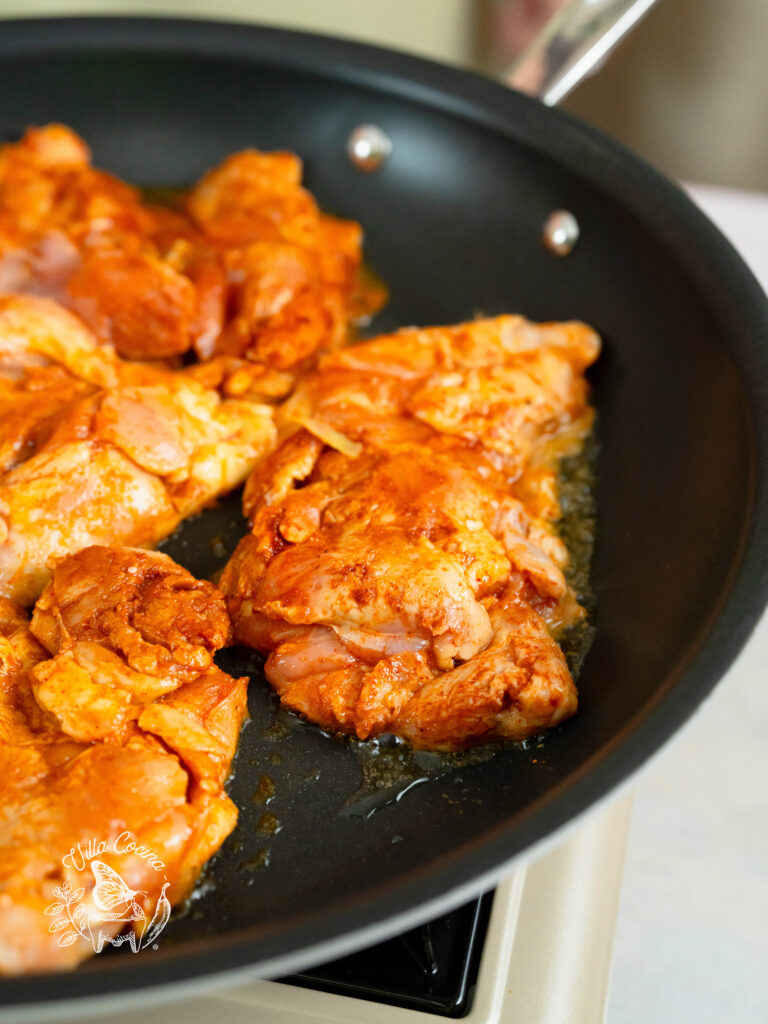 Chicken cooking on a pan